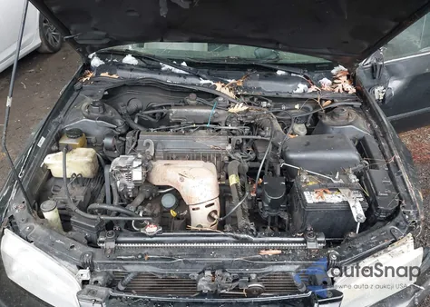 1997 Toyota Camry Le z USA, uszkodzony, nr VIN JT2BG22K5V0021599